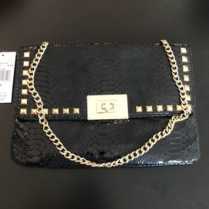 Snake print black clutch